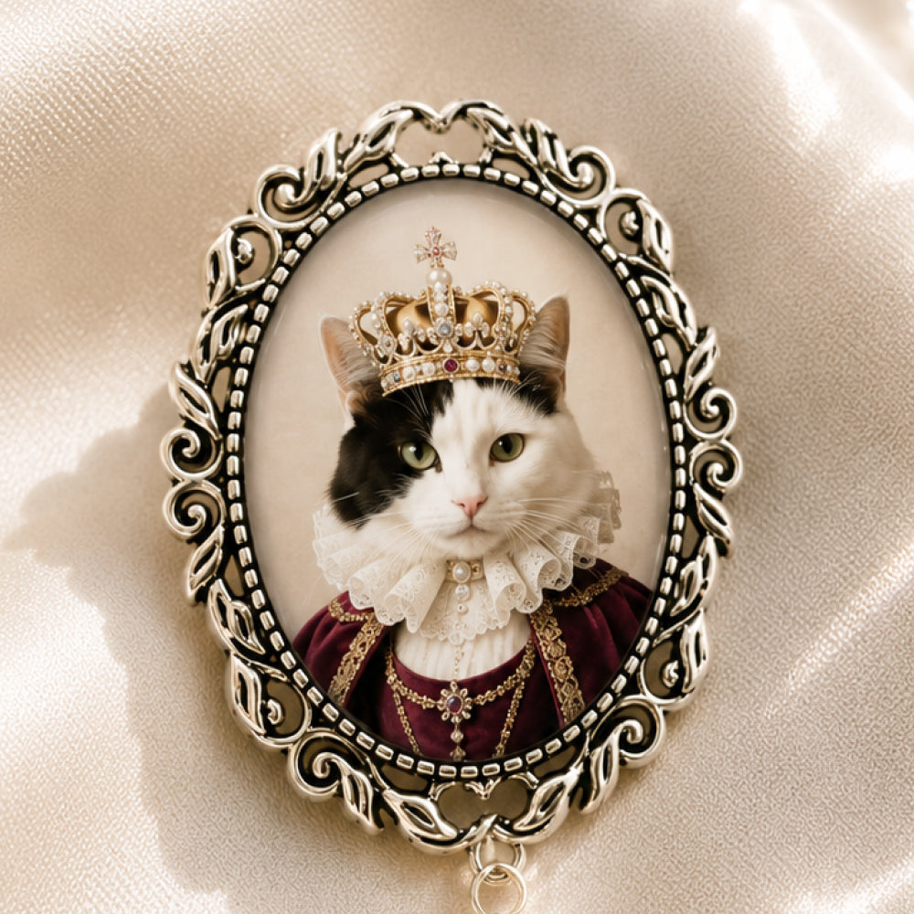 Close-up of Vintage Pearl Brooch with custom royal cat portrait.