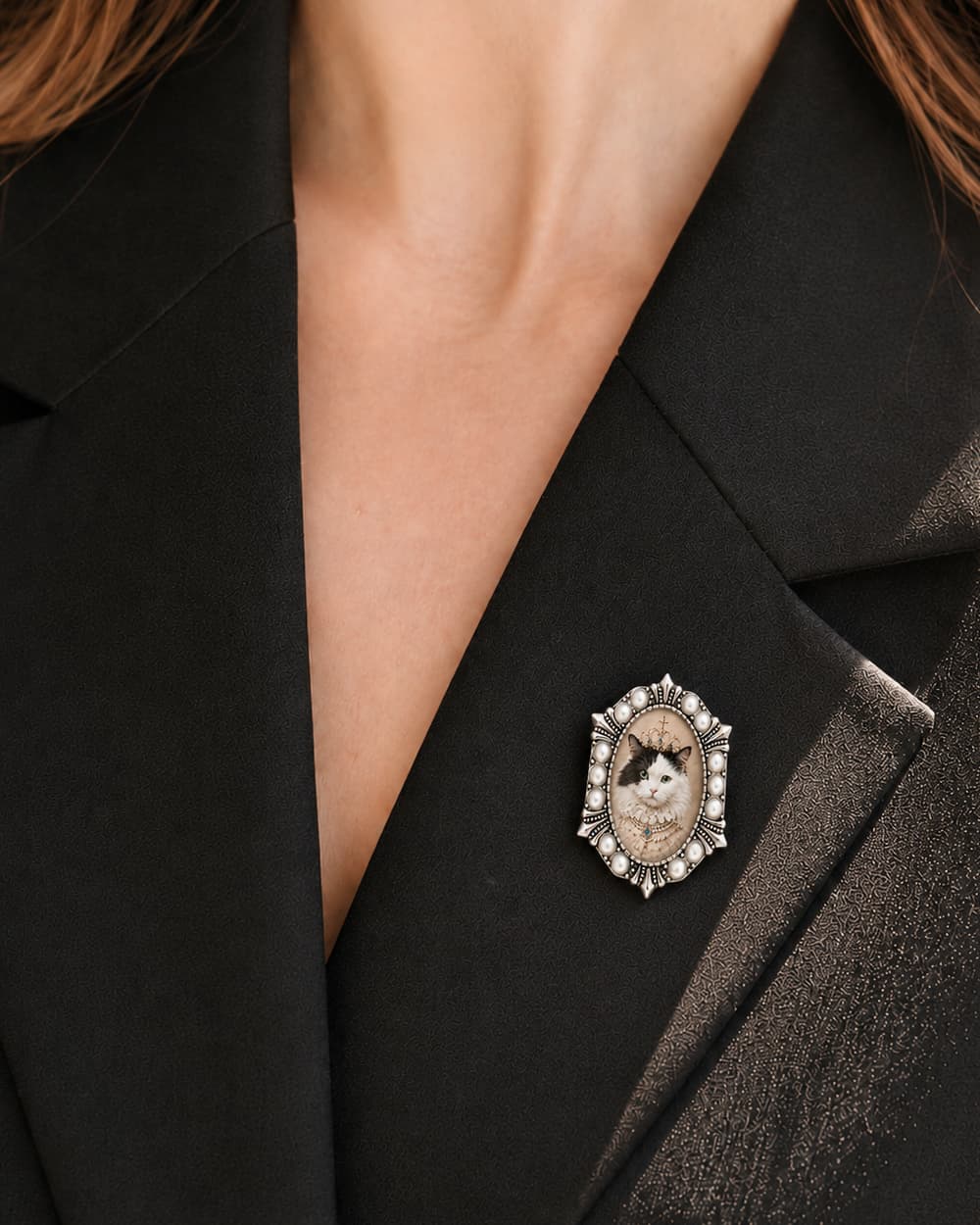 Pearl Hex custom pet portrait brooch worn on a black blazer.
