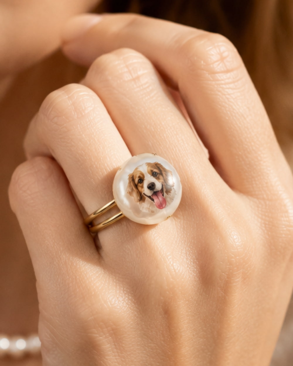 Hand wearing custom dog portrait baroque pearl ring