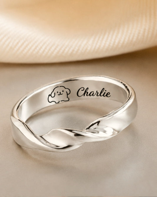 Custom dog memorial ring engraved with Charlie in handmade 999 fine silver.