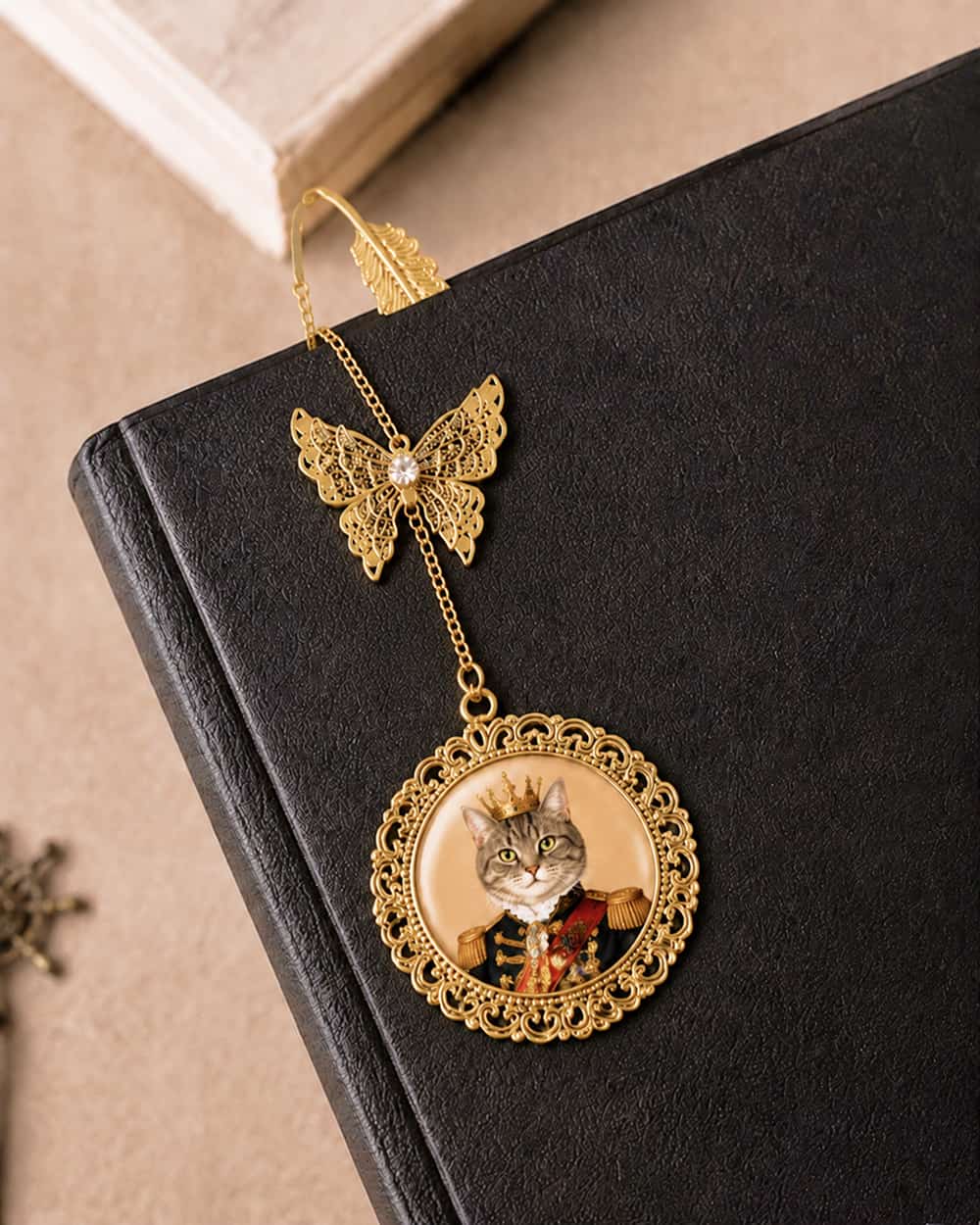 Gold personalized pet portrait bookmark placed in a book, custom made from a pet photo.