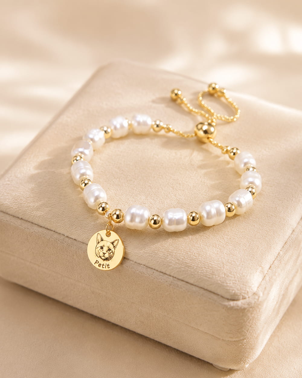 Personalized pet pearl bracelet with custom photo charm and engraved pet name.