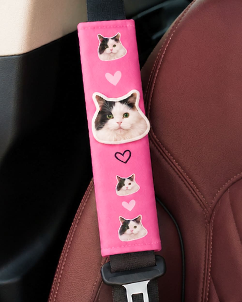 Personalized pink seat belt cover featuring a custom 3D cat portrait.